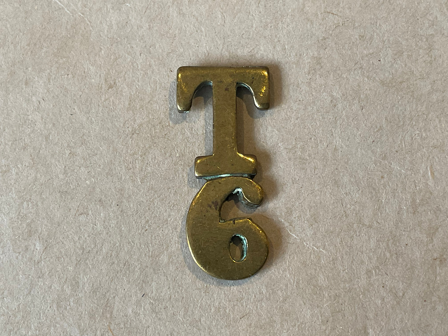 British Army T/6 (6th Territorial Battalion) brass title.