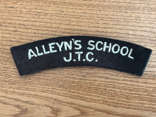 ALLEYN’S SCHOOL J.T.C white embroidery on black wool backing cloth shoulder title.
