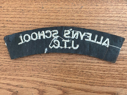 ALLEYN’S SCHOOL J.T.C white embroidery on black wool backing cloth shoulder title.