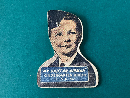 WWII fundraising cardboard lapel badge by the Kindergarten Union of South Africa Inc.
