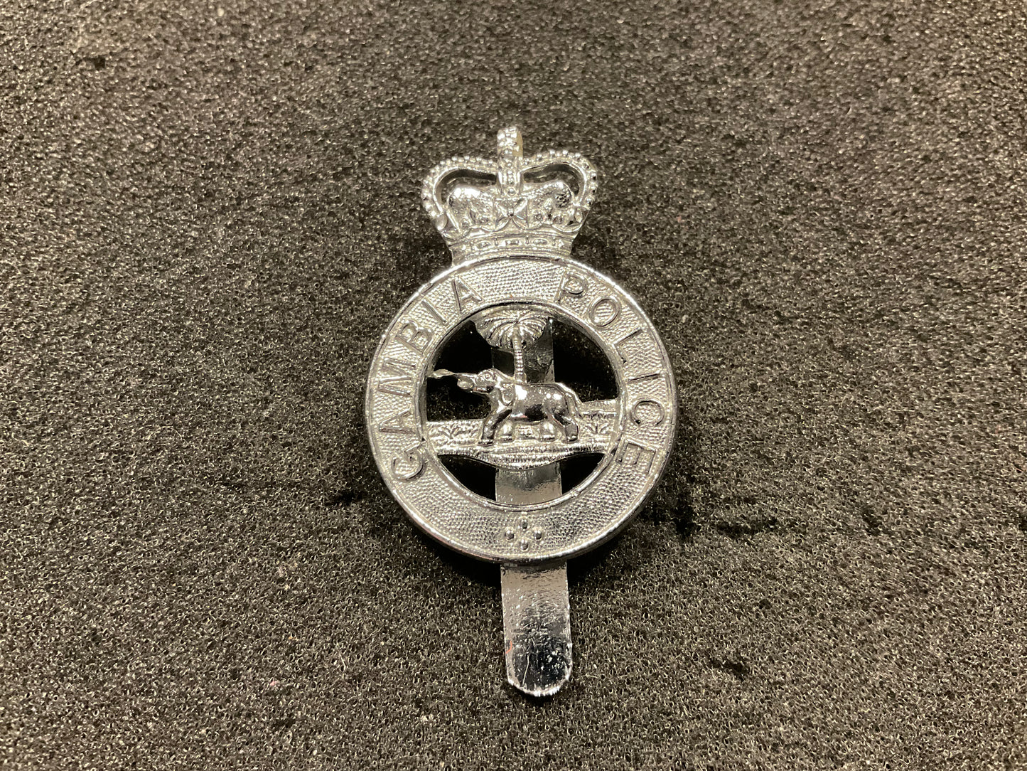 Pre 1967 Gambia Police cap badge by DOWLER.