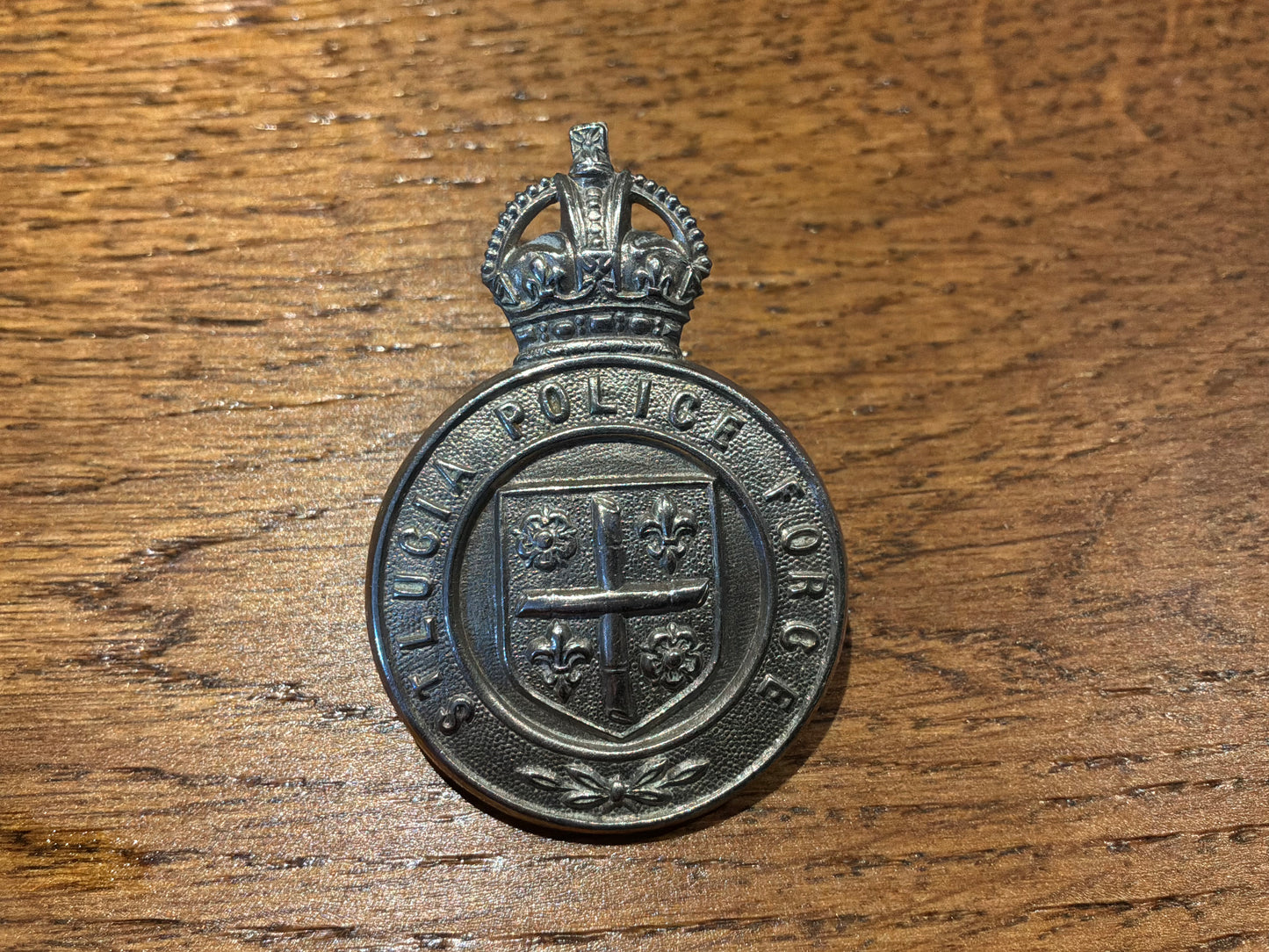 Pre 1952 K/C St Lucia Police w/m cap badge.