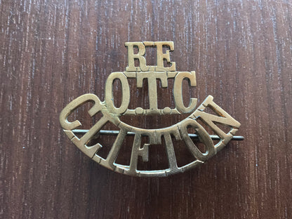 RE/OTC/CLIFTON brass shoulder title.