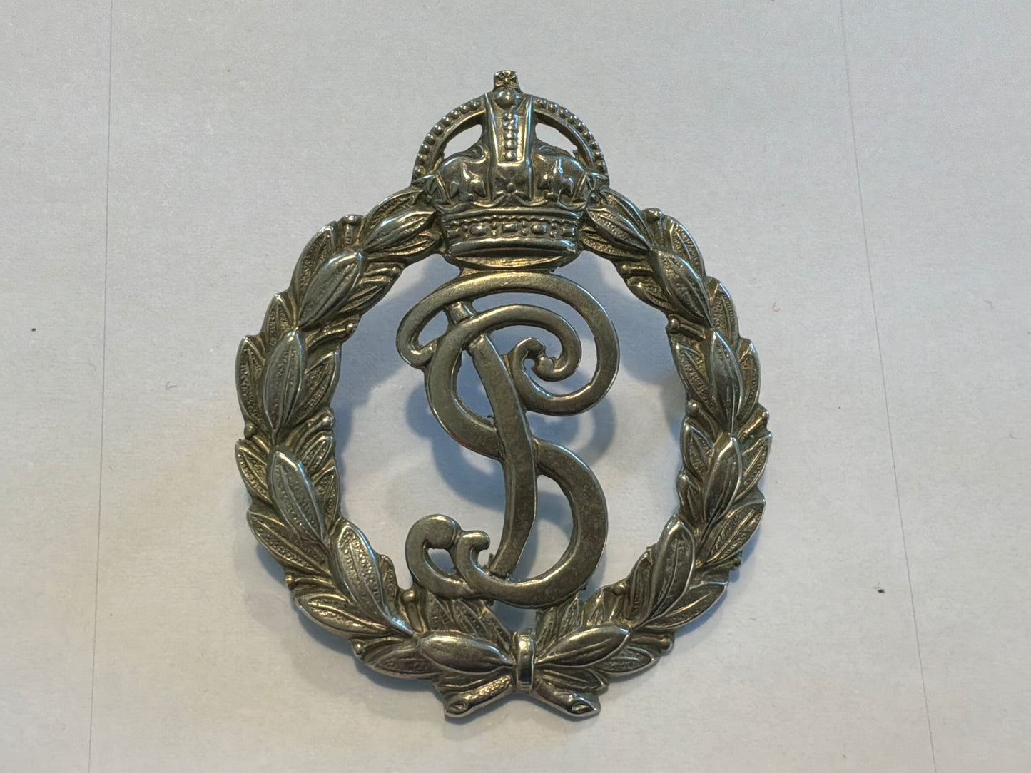 Post 1902 Seychelles Police cap badge.