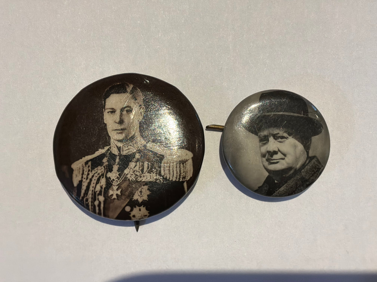 Patriotic King George VI and Winston Churchill celluloid badges.