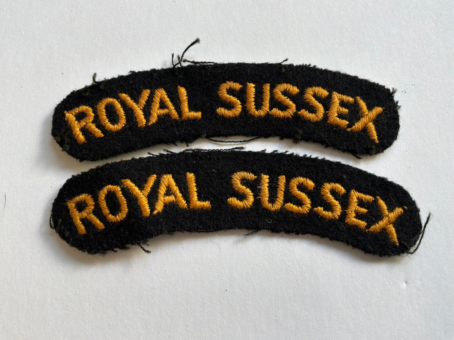 Post WW2 ROYAL SUSSEX Regt cloth shoulder titles.