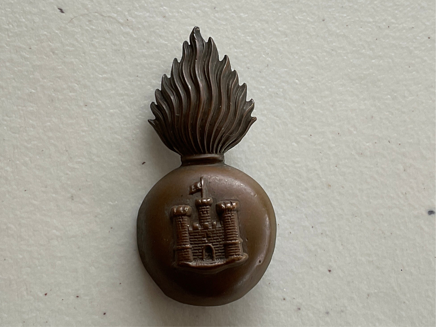 Gradia Militaria -  Post 1881 Royal Inniskilling Fusiliers foreign service helmet badge