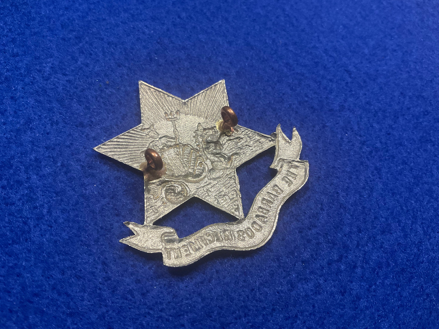 The Barbados Regiment white metal cap badge