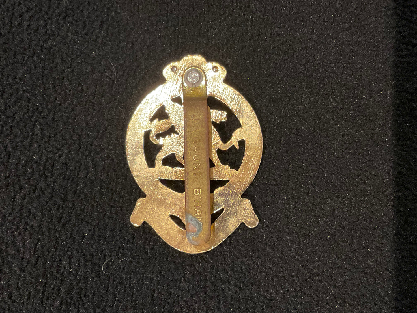 The Queens Regiment, early anodised cap badge with riveted brass slider
