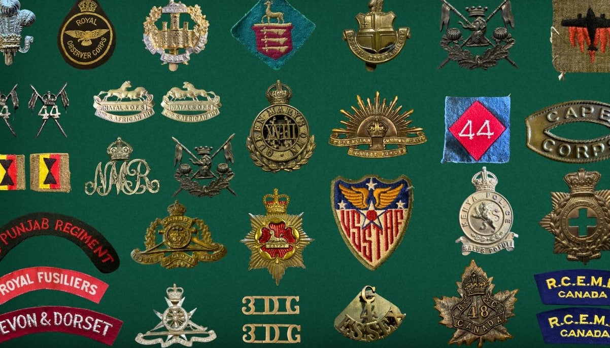 Collection of military badges displayed on a green background