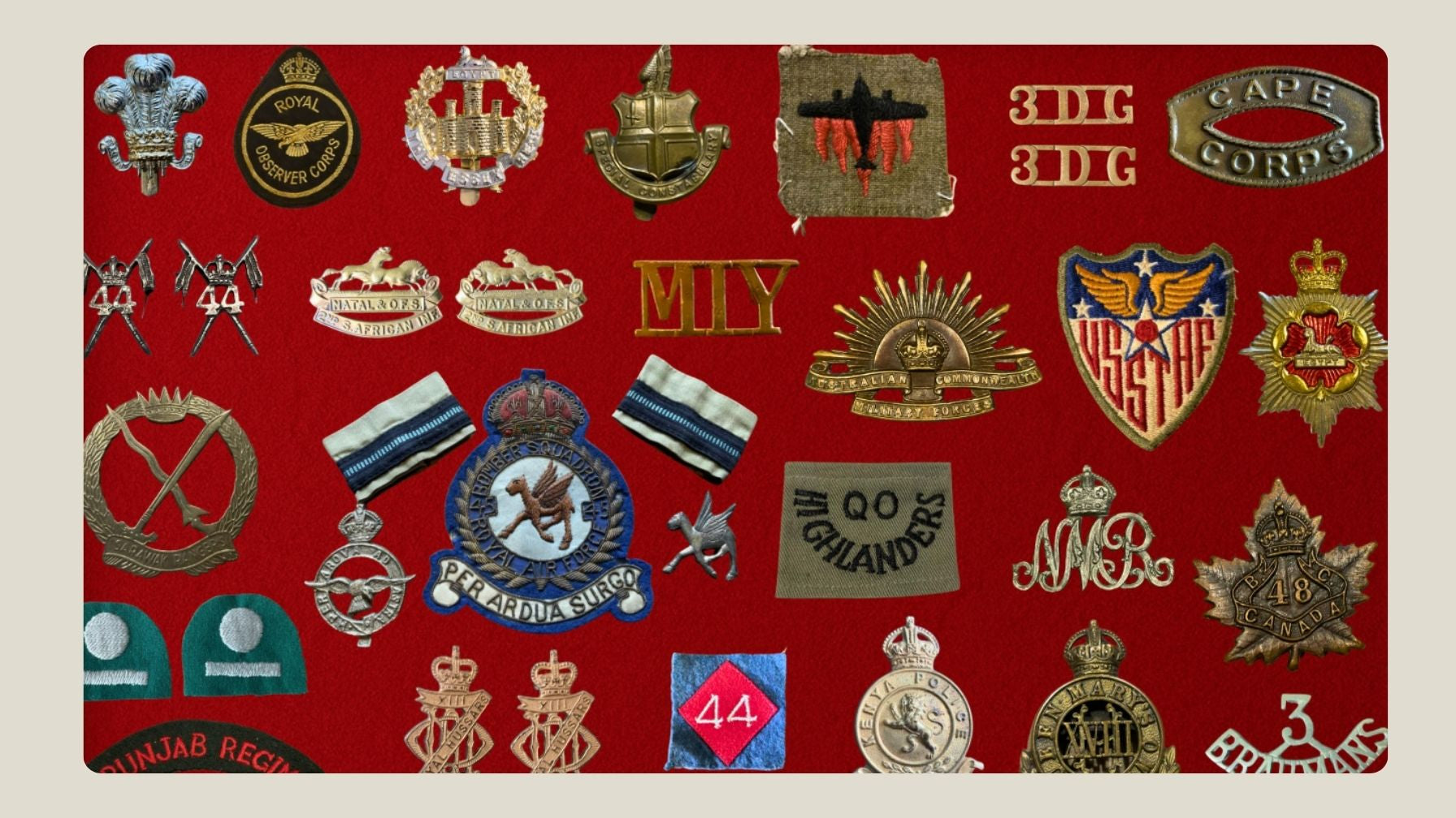 Collection of various military insignias on a red background