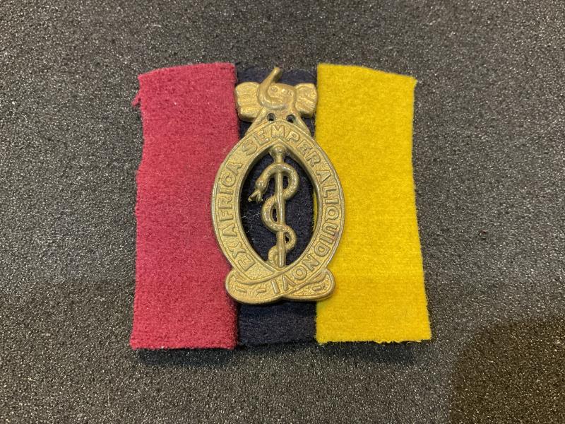 WW2 East Africa Medical Corps cap badge & backing