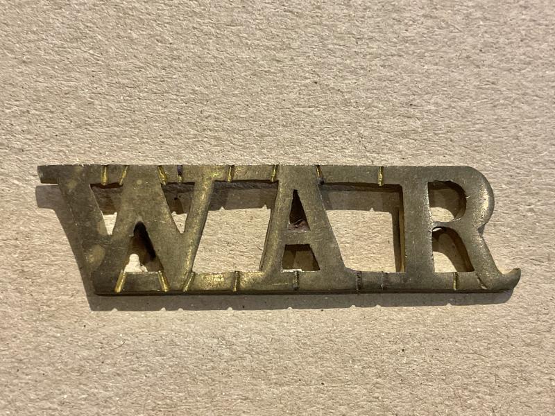 West Africa Regiment (W.A.R) brass shoulder title